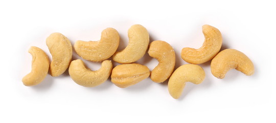 Salted cashew nuts isolated on white background, top view