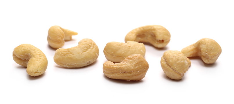 Salted cashew nuts isolated on white background