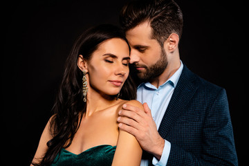 Close up photo rich pair classy she her chic eyes closed enjoy he him his hold touch shoulders tenderness piggyback pose wear blue plaid costume jacket velvet green dress isolated black background