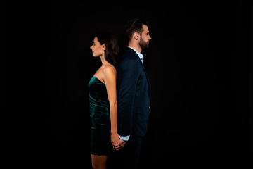 Close up side profile photo amazing pair she her chic he him his macho stand back to back tender wedding dance motion wear blue costume jacket green glossy velvet dress isolated black background