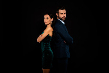 Obraz premium Close up side profile photo amazing pair she her chic he him his macho stand back to back arms crossed best partnership wear blue costume jacket green glossy velvet dress isolated black background