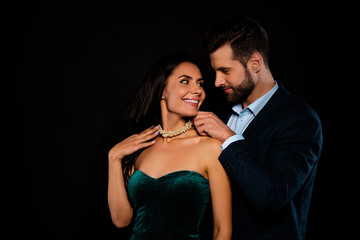 Close up side profile photo two beautiful people she her classy chic he him his macho deliver receive take on neck bijouterie jewel wear plaid blue costume jacket green dress isolated black background