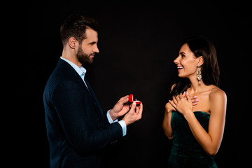 Profile side view portrait of nice gorgeous lovely attractive luxury fascinating cheerful dreamy two person giving receiving expensive dream rich wealthy guy isolated over black background