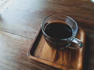 cup of coffee on wooden table
