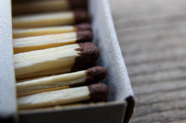 matches on a gray wooden board, macro shooting