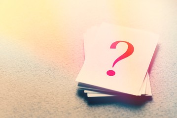 Pile of cards with printed question marks
