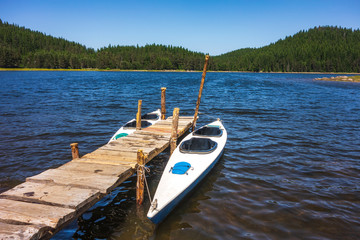lake, kayak, boat, pier, water, nature, summer, blue, travel, canoe, landscape, sky, mountain, green, tourism, tranquil, park, river, vacation, calm, national, red, outdoors, scenic, view, dock, fores