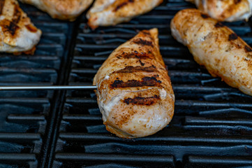 grilled striped chicken on a grill in Sweden