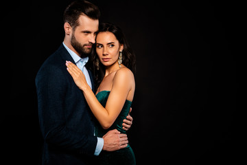 Close up side profile photo beautiful she her wife earrings he him his husband mrs mr married spouse hands hold waist look empty space wear costume jacket green glossy dress isolated black background