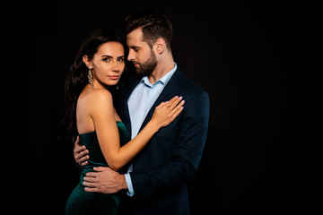 Close up side profile photo beautiful she her wife bride he him his husband fiance mrs mr married spouse protect hands slim waist hold close wear costume jacket green dress isolated black background