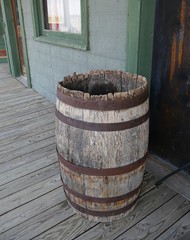 Old wooden barrel in an old wooden building