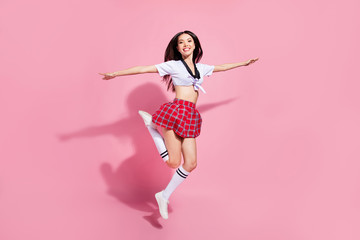 Full length body size view of her she nice-looking attractive lovely charming slender cheerful cheery straight-haired lady having fun flying like plane isolated over pink pastel background
