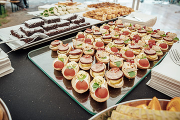 Catering for birthday party, wedding, event. Grilling meat, corn, burger, sausage, sunflower, vegetables. Fruit Dishes, Dessert, Salads, Pasta, Sweets