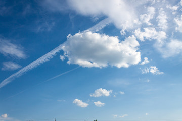 Naklejka na ściany i meble Clouds on a blue sky on a Sunny day