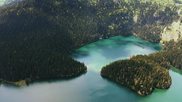 Aerial shot of a beautiful emerald lake in the mountains of Durmitor, Montenegro, view from above