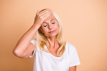 Photo of lady arm fingers hold arm forehead eyes closed caught cold unwell wear white casual...