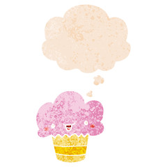 cartoon cupcake with face and thought bubble in retro textured style