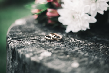 wedding rings on a bouquet of flowers