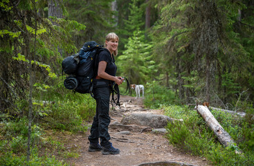 Fototapeta na wymiar Wooman hiking in forest