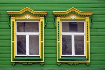 wooden window with carved platbands.