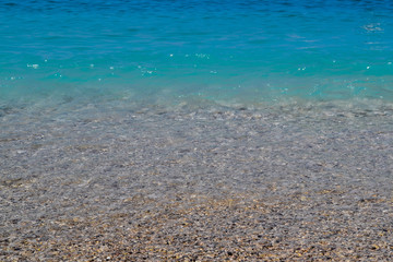 Obraz premium Calm sea or ocean. Blue or azure water color. Clear and blue sky. Sunny summer weather. Beach, cruise, tropical island.