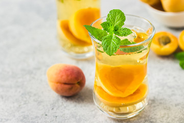 Summer drink, apricot mint tea. Selective focus, space for text.