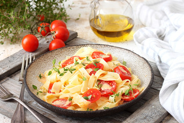 Pasta Fettuccine with cream sauce and cherry tomatoes