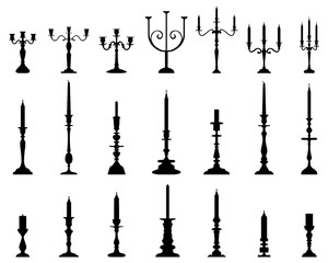 Black silhouettes of candlesticks on a white background - obrazy, fototapety, plakaty