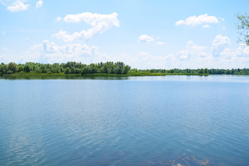 Large wide lake in nature. Summer landscape.