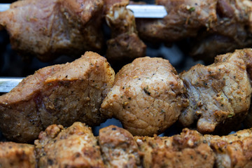 Grilled pork barbecue cooked on a grill, close-up