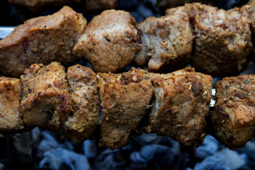 Grilled pork barbecue cooked on a grill, close-up