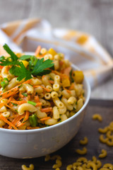 Pasta Salad with vegetable in a white bowl 