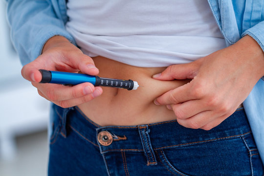 A Diabetic Patient Makes An Insulin Injection With Insulin Pen At Home. Treatment Sugar Diabetes