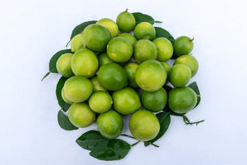 lemon with green leaves on white background