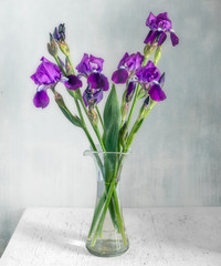 Still life with a bouquet of irises. Vintage.