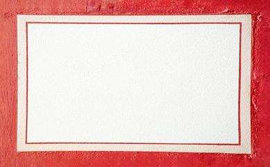 white wall with red frame of an old half timbered house as space for messages
