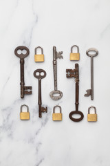 Vintage keys and padlocks overhead lay flat composition. Security concept