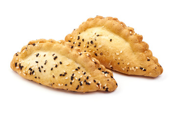 Freshly baked patties with sesame seeds, close-up, isolated on white background