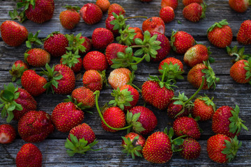 Fresh strawberries on an old wooden table