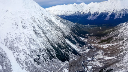 Helicopter flying over Alaska glacier