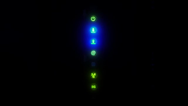 Wi-Fi route, wireless home internet modem indicators led lights of the connection. Signals blink on modem. 4K