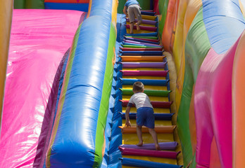 Fototapeta na wymiar little boy on slide