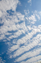 Naklejka na ściany i meble Blue sky background with abstract white clouds