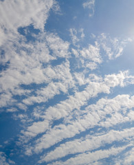 Blue sky background with abstract white clouds