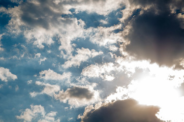 Dramatic cloudscape background with gray clouds and sunlight