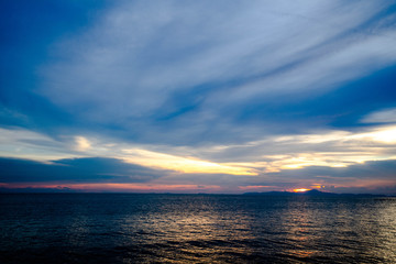 Fototapeta premium Colorful sunset with dramatic of purple , magenta and orange cloudy sky in evening over an ocean.