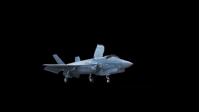 F-35 fighter takes off vertically from the aircraft carrier in clear day. Contains the alpha channel.