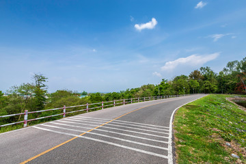 road view reservoir green tree and blue sky background.