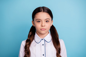 Close up photo of charming child minded isolated over blue background