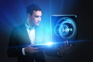 The concept of business, technology, the Internet and the network. A young entrepreneur working on a virtual screen of the future and sees the inscription: GDPR